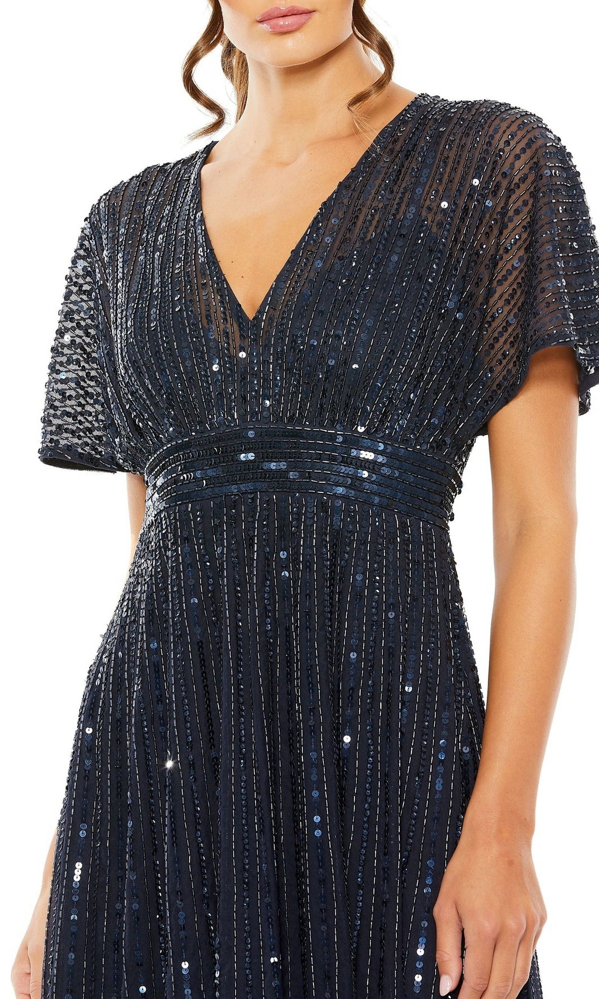 Woman wearing the Mac Duggal 14007, a short-sleeved, deep V-neck navy sequin dress with vertical embellishments and fitted waistband—the ideal semi-formal short sequin wedding-guest dress for any special occasion.